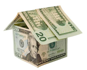 Small model of a house made with U.S. currency