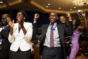 Attendees of the Summit of the Washington Fellowship for Young African Leaders cheer as President Barack Obama announces that the program will be renamed in honor of former South African President Nelson Mandela, Monday, July 28, 2014, in Washington. The summit is the lead-up event to next week's inaugural U.S.-Africa Leaders Summit, the largest gathering any U.S. President has held with African heads of state.