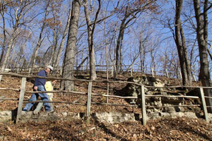 In this Nov. 8, 2010 file photo, Paul and Sue Schramm, of Dyersville, Iowa, hike one of the trails at Effigy Mounds National Monument in Harpers Ferry, Iowa.