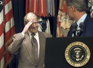 In this May 28, 1996 file photo, retired Admiral Elmo Zumwalt Jr., salutes President Bill Clinton, during a ceremony at the White House in Washington, after the president announced expanded benefits to veterans suffering side effects from exposure to Agent Orange during the Vietnam War. Zumwalt lost a son who died from diseases related to Agent Orange and was an avid supporter of increased benefits for veterans.