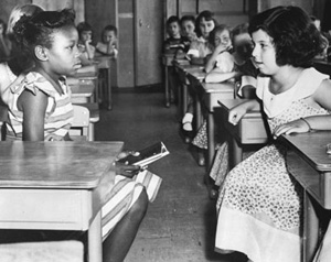 Are schools today, while integrated, are in fact still just as segregated as they were sixty years ago?