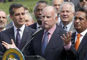 California Gov. Jerry Brown speaks at Los Angeles City Hall before signing the AB 60 bill in Los Angeles Thursday, Oct 3, 2013. The bill adds California to the growing list of states allowing immigrants in the country illegally to obtain driver licenses.