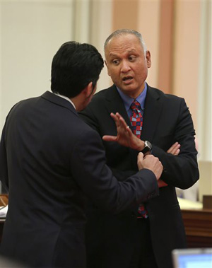 Sen. Ed Hernandez, D-Covina, right, talks with Sen. Kevin de Leon, D-Los Angeles at the Capitol in Sacramento, Calif., Monday, April 21, 2014. Hernandez's proposal sailed through the state Senate in January on a Democratic Party-line vote. Legislative leaders, however, pulled the bill before it could be debated in the Assembly after the harsh reaction.