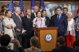 House Minority Leader Nancy Pelosi of Calif., accompanied by member of the Congressional Hispanic Caucus and Democratic leaders, speaks during a news conference on Capitol Hill in Washington, Friday, Aug. 1, 2014, as the House tries to deal with legislation on the border crisis, a day after Congress was supposed to go into its August recess.