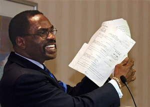 In this Jan. 29, 2004 file photo, former boxer, Rubin, &quot;Hurricane&quot; Carter, holds up the writ of habeas corpus that freed him from prison, during a news conference held in Sacramento, Calif.