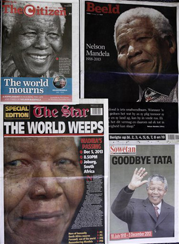 South African newspapers headline the news of former president Nelson Mandela's passing, Johannesburg, Friday, Dec. 6, 2013. Mandela passed away Thursday night after a long illness. He was 95. As word of Mandela's death spread, current and former presidents, athletes and entertainers, and people around the world spoke about the life and legacy of the former South African leader.