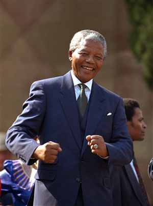 In this May 10, 1994, file photo, Nelson Mandela dances at a celebration concert in Pretoria, South Africa, following his inauguration as the country's first black president.