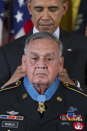 Sgt. 1st Class Jose Rodela is awarded the Medal of Honor by President Barack Obama during a ceremony in the East Room of the White House in Washington, Tuesday, March 18, 2014.