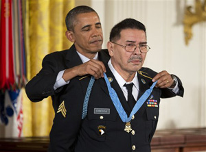 President Barack Obama awards Army Spc. Santiago Erevia the Medal of Honor during a ceremony in the East Room of the White House in Washington, Tuesday, March 18, 2014.