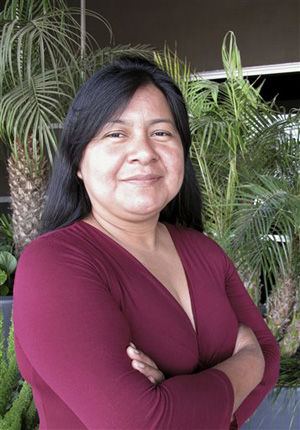 In this April 23, 2014 photo, Silvia Lopez, a farmworker at Gerawan Farming, Inc., poses for a photograph in Fresno, Calif. Lopez, 38, led a petition last year to hold a vote among workers, hoping to reject representation by the United Farm Workers. The votes have yet to be counted, and the case is playing out in court.