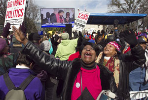 Kathy Jones reacts during the closing remarks by Rev. William Barber at the &quot;Moral March on Raleigh&quot; on Fayetteville Street in Raleigh, N.C., on Saturday, Feb. 8, 2014.