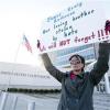 Amelie Hahn, braves cold weather as she holds a poster memorializing the 2011 rundown death of James Craig Anderson in front of the federal courthouse in Jackson, Miss., Wednesday, Jan. 7, 2015. Two of the men charged in the series of 2011 racial beatings that resulted in Anderson's death attended change-of-plea hearing.