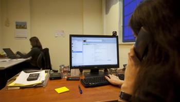 In this file photo taken Dec. 16, 2010, Israeli project manager Gali Kahane sits in front of a computer in the office of Comply, an Israeli start-up that employs Palestinians, in Hod Hasharon, near Tel Aviv. Israel’s flourishing tech industry, where major global companies have offices and startups abound, has earned the country the nickname "Startup Nation."