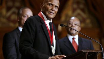 Artist and activist Harry Belafonte addresses an audience after accepting the W.E.B. Du Bois medal during ceremonies, Tuesday, Sept. 30, 2014, on the campus of Harvard University, in Cambridge, Mass. The Du Bois Medal is Harvard's highest honor in the field of African and African American Studies.