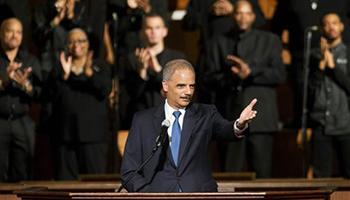 U.S. Attorney General Eric Holder gestures as he speaks to members of the community during an interfaith service at Ebenezer Baptist Church, the church where The Rev. Martin Luther King Jr. preached, Monday, Dec. 1, 2014, in Atlanta. Holder traveled to Atlanta to meet with law enforcement and community leaders for the first in a series of regional meetings around the country. The president asked Holder to set up the meetings in the wake of clashes between protesters and police in Ferguson, Missouri.