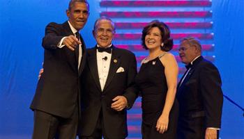 President Barack Obama, left, points toward a camera with chairman of the Congressional Hispanic Caucus Rep. Ruben Hinojosa, D-Texas, Marty Hinojosa, and Sen. Bob Menendez, D-N.J., at the Congressional Hispanic Caucus Institute’s 37th Annual Awards Gala at the Walter E. Washington Convention Center in Washington, Thursday, Oct. 2, 2014.