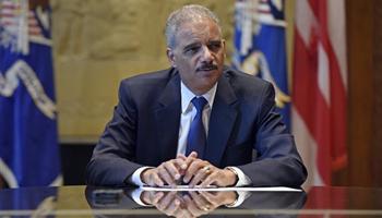 Attorney General Eric Holder speaks during an interview with The Associated Press at the Justice Department in Washington, Tuesday, Sept. 16, 2014. Broadening its push to improve police relations with minorities, the Justice Department has enlisted a team of criminal justice researchers to study racial bias in law enforcement in five American cities and recommend strategies to address the problem nationally, Holder said Tuesday.