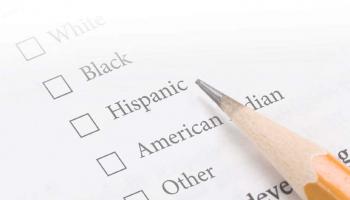 a list of ethnicities on paper with a pencil