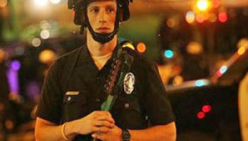 white police officer in riot gear