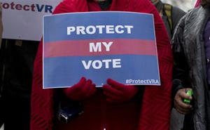 In this Feb. 27, 2013 file photo, people wait in line outside the Supreme Court in Washington to listen to oral arguments in a voting rights case. In last week’s elections, Alabama Republicans shrank their once-powerful Democratic opponents to just eight seats in the state Senate, all of them from districts in which African-Americans are a majority.