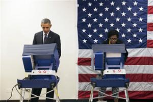In this Oct. 20, 2104 file photo, President Barack Obama votes early for the midterm election at the Dr. Martin Luther King Community Service Center in Chicago. President Barack Obama is hitting the black radio airwaves to plead for midterm votes.