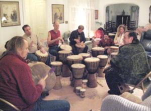 musicians around a group of drums