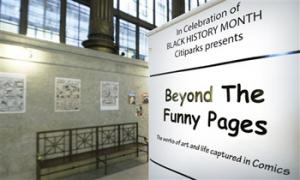 In this Wednesday, Feb. 5, 2014 photo, an exhibit at the City/County building in downtown Pittsburgh is highlighting early artists who helped break the comic book color barrier by featuring black characters and a publisher who started to break the comic color barrier in the 1930s and 1940s.