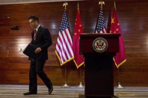 Gary Locke, the outgoing U.S. ambassador to China, leaves after a farewell news conference held at the U.S. Embassy in Beijing. A major Chinese government news service used a racist slur to describe Locke in a mean-spirited editorial on Friday that drew widespread public condemnation in China.