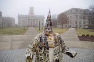 This KKK statue as an art form was displayed on the campus of the University of Iowa by a visiting professor and incited a strong reaction from black students.