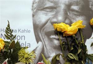A portrait former president Nelson Mandela, placed outside his residence in Johannesburg, South Africa, Monday, Dec. 9, 2013. Mandela died Thursday Dec. 5 at his Johannesburg home after a long illness. He was 95.
