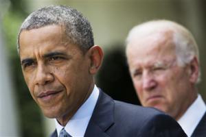 In this June 30, 2014, file photo, President Barack Obama, accompanied by Vice President Joe Biden, pauses while making a statement about immigration reform, in the Rose Garden of the White House in Washington. Obama over time has been embraced and scorned by immigrant advocates who have viewed him as both a champion and an obstacle to their cause.