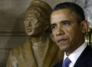 President Obama standing in front of Rosa Parks statue