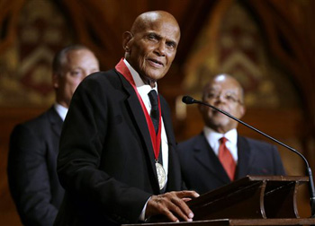 Artist and activist Harry Belafonte addresses an audience after accepting the W.E.B. Du Bois medal during ceremonies, Tuesday, Sept. 30, 2014, on the campus of Harvard University, in Cambridge, Mass. The Du Bois Medal is Harvard's highest honor in the field of African and African American Studies.