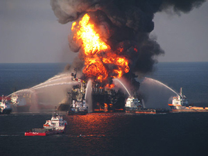 boats attempt to extinguish the burning Deepwater Horizon off-shore oil rig