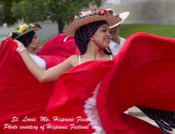 Women dancing in red dresses at Hispanic Fiesta in St. Louis, Missouri