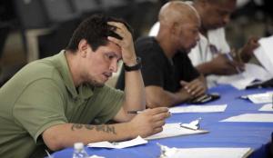 Man filling out unemployment claim