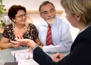 Couple talking to financial planner