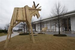 wooden moose sculpture titled Elk Towers