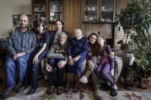 Mark Rozin, 47, Daniil Rozin, 11, Lev Rozin, 24, Anatoly Rozin, 78, Geda Zimanenko, 100, Luiza Rozina, 78, Maya Rozina, 8 pose in their Moscow apartment. The four generations of Zimanenko- Rozin's family embody the history of Jews in Russia over the past century, from the restrictions of czarist times to the revival of Jewish culture in Russia today. (AP Photo/Sergey Ponomarev)