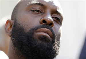 Michael Brown Sr., listens to speakers during a news conference outside the Old Courthouse, Tuesday, Aug. 12, 2014, in St. Louis. Brown's son Michael, 18, who was unarmed, was shot to death Saturday by a Ferguson police officer while walking with a friend down the center of the street.