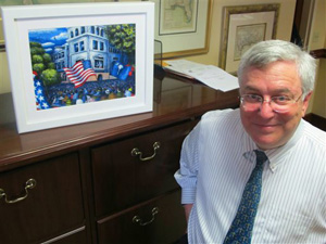 U.S. District Judge Richard Gergel poses in his office in the federal courthouse in Charleston, S.C., on Thursday, April 3, 2014 beside a painting by noted artist Jonathan Green. The painting depicts the outside of the courthouse in 1951 when three federal judges heard a school desegregation case from Clarendon County, S.C.