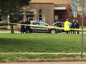 In this photo provided by KSHB41 Action News in Kansas City, MO, authorities respond the Jewish community center after a shooting in Overland Park, Kan., Sunday, April 13, 2014.