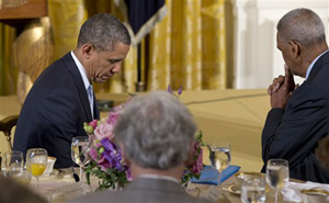 President Barack Obama closes his eyes as Dr. Joel C. Hunter, senior pastor of Northland, A Church Distributed, in Longwood, Fla., says the prayer during the Easter Prayer Breakfast, Monday, April 14, 2014, in the East Room of the White House in Washington.