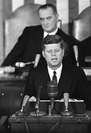 In this Jan. 14, 1963 file photo, President John F. Kennedy speaks in the House Chamber on Capitol Hill in Washington during his State of the Union report to a joint session of Congress with Vice President Lyndon Johnson sitting behind him. Kennedy's civil rights legacy has undergone substantial reassessment since his Nov. 22, 1963, assassination.