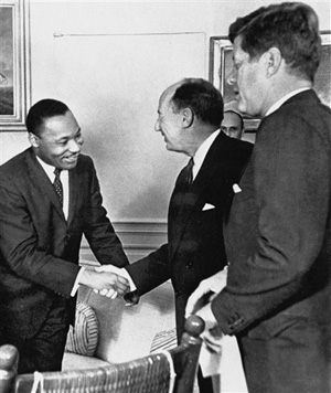 In this Dec. 17, 1962 file photo, Ambassador Adlai Stevenson, the U.S. delegate to the United Nations, shakes hands with Martin Luther King Jr., president of the Southern Christian Leadership Conference, Atlanta, Ga., at the White House in Washington with President John F. Kennedy at right. The meeting occurred as Kennedy met with members of the American Negro Leadership Conference on Africa.