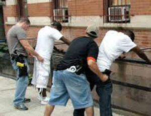 police frisking African-American youths