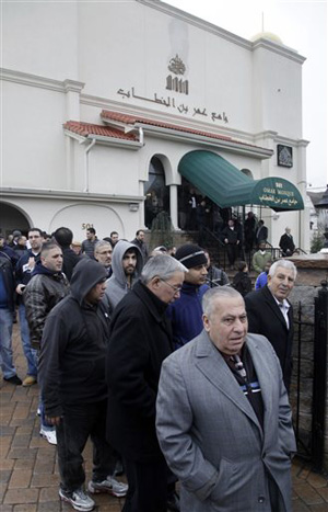 In this Feb. 24, 2012, file photo, a large crowd leaves the Masjid Omar mosque following afternoon prayers in Paterson, N.J. The Masjid Omar mosque was identified as a target for surveillance in a 2006 New York Police Department report uncovered by The Associated Press. The NYPD announced on Tuesday, April 15, 2014, that it has disbanded the special unit responsible for the surveillance program.