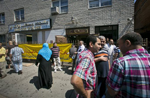 In this Aug. 16, 2013, file photo, visitors socialize after a Jumu'ah prayer service outside the Islamic Society of Bay Ridge and mosque in the Brooklyn borough of New York. The New York Police Department targeted the mosque as a part of a terrorism enterprise investigation beginning in 2003, spying on it for years.