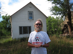 Craig Cobb stands in front of his home in Leith, North Dakota prior to his arrest. Now in prison, he fears repercussions of his actions and wants to leave the state.