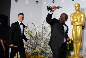 Brad Pitt, left, and Steve McQueen pose in the press room with the award for best picture for &quot;12 Years a Slave&quot; during the Oscars at the Dolby Theatre on Sunday, March 2, 2014, in Los Angeles.